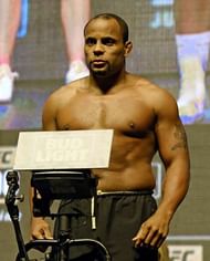 LAS VEGAS, NV - JULY 08:  Mixed martial artist Daniel Cormier poses on the scale during his weigh-in for UFC 200 at T-Mobile Arena on July 8, 2016 in Las Vegas, Nevada. Cormier will meet Anderson Silva in a non-title light heavyweight bout on July 9 at T-Mobile Arena. Silva replaces Jon Jones who was pulled from a light heavyweight title fight against Cormier due to a potential violation of the UFC's anti-doping policy.  (Photo by Ethan Miller/Getty Images)